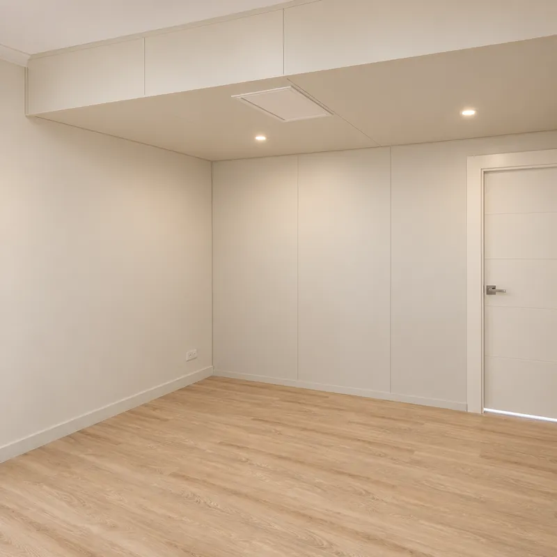 QuickRooms conversion with visible wall and ceiling panels and timber-look flooring